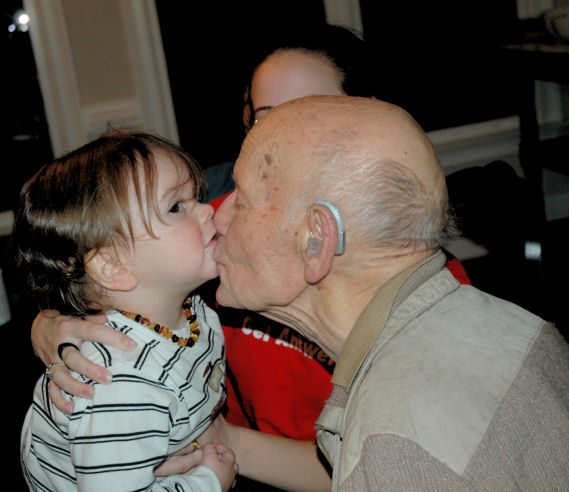 Giving Great Grandpa Kisses