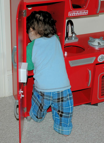 Playing with the play kitchen